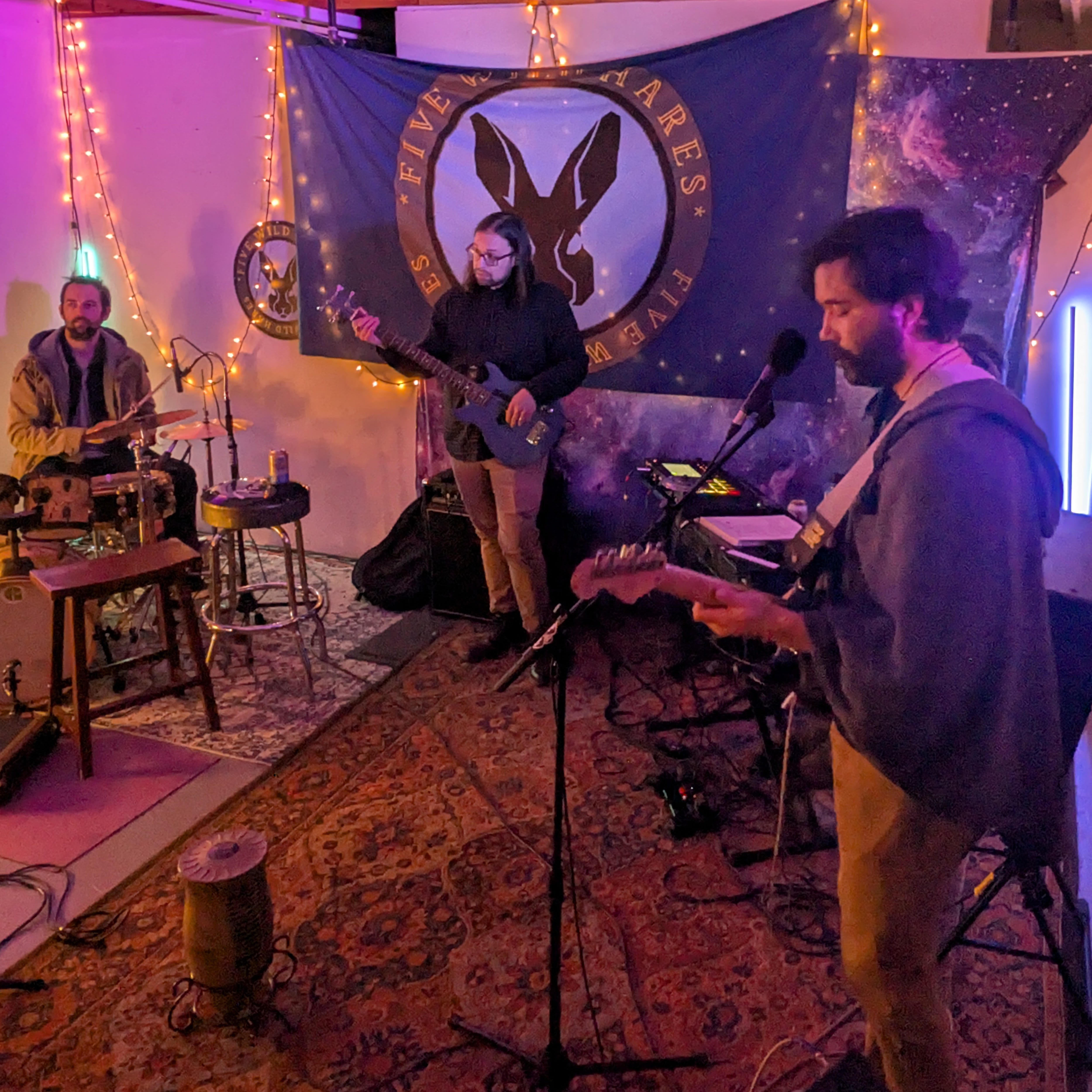 Five Wild Hares Drew and Dave with the five wild hares banner hanging in the background